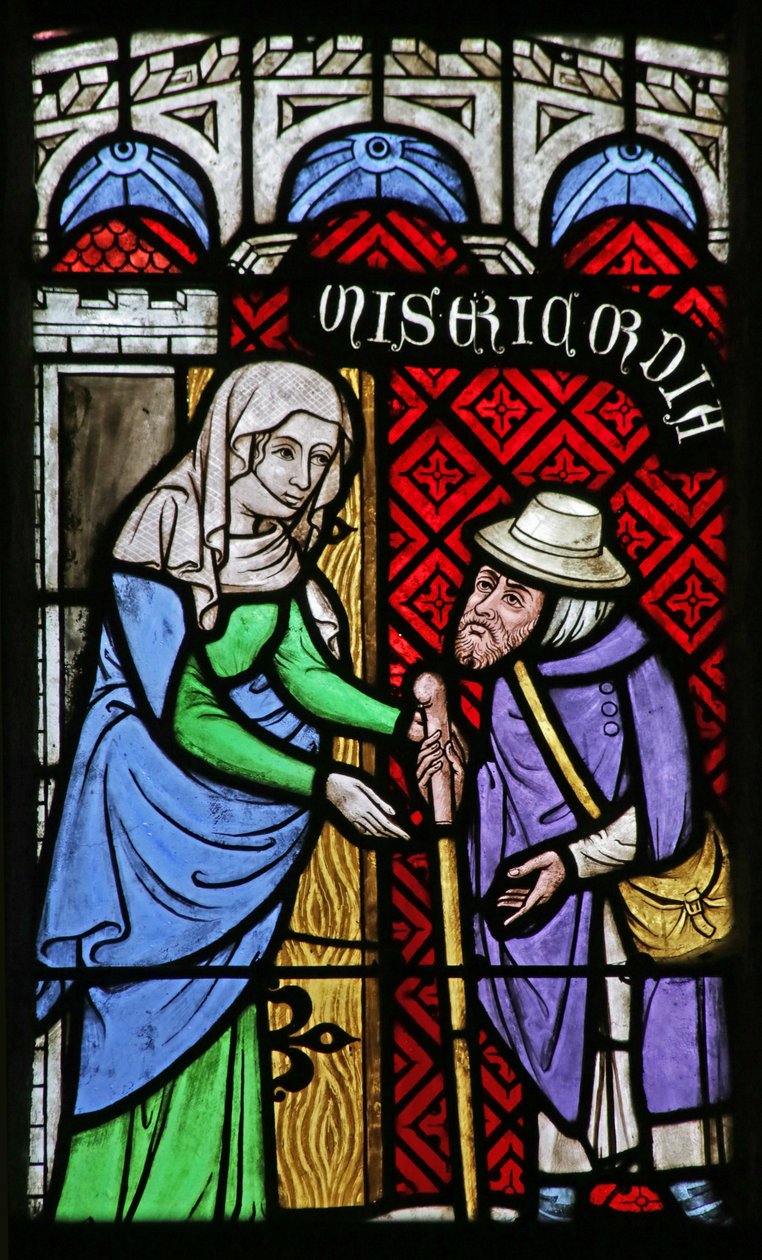Vitrail représentant les œuvres de miséricorde : Accueillir l