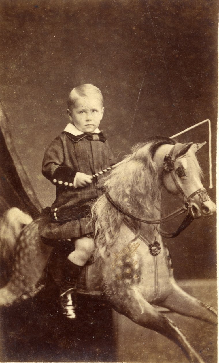 Jeune garçon avec fouet sur cheval à bascule, 1870s - H. A. Chapman