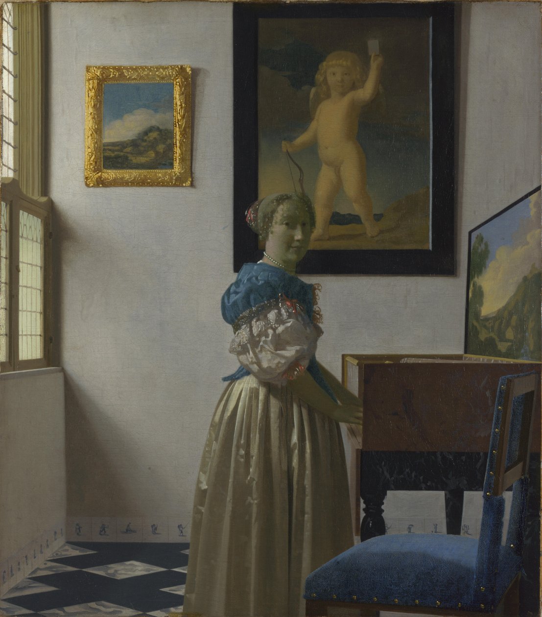 Une jeune femme debout devant un virginal - Johannes Vermeer