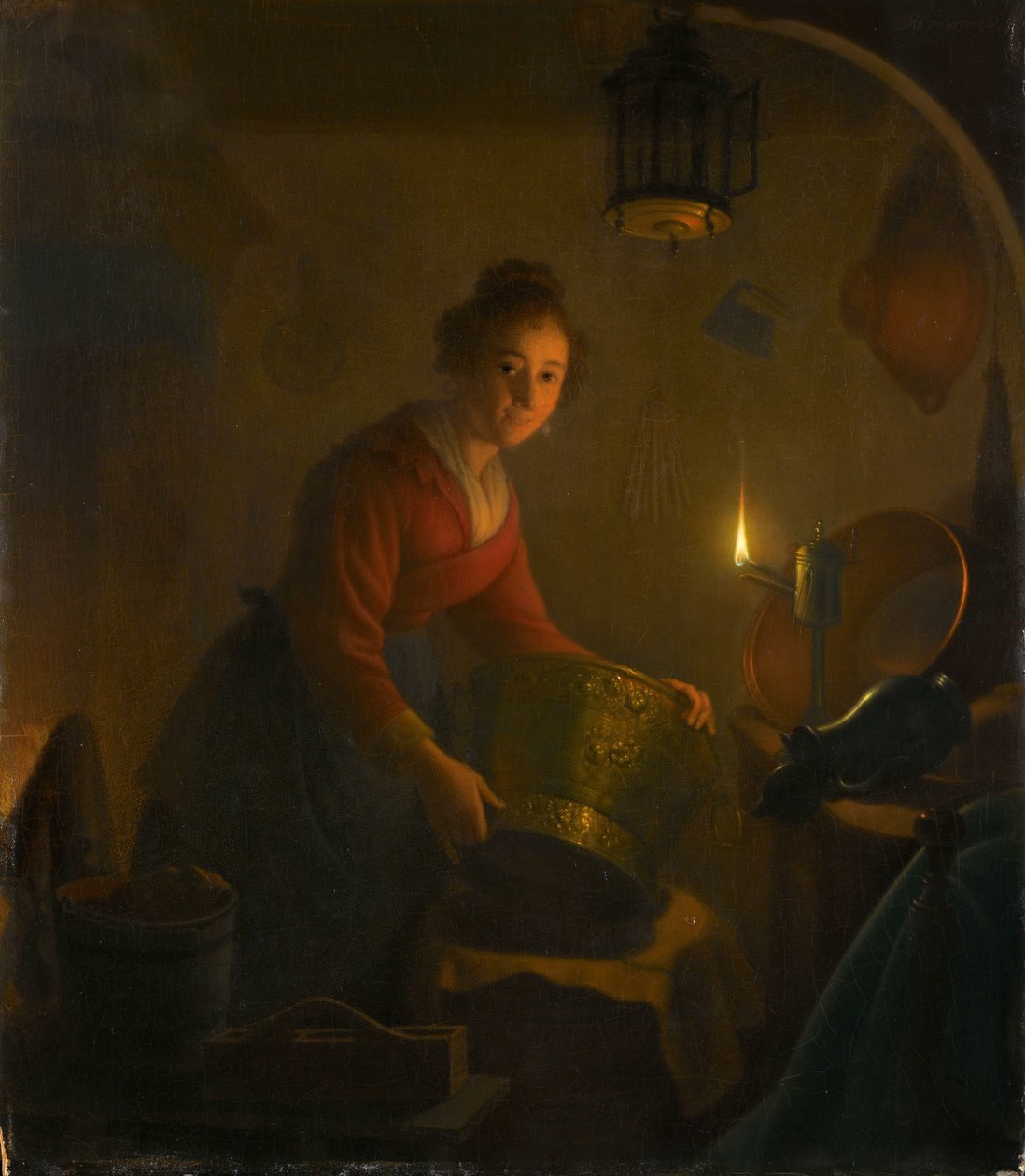 Une femme dans une cuisine à la lumière des bougies - Michiel Versteegh