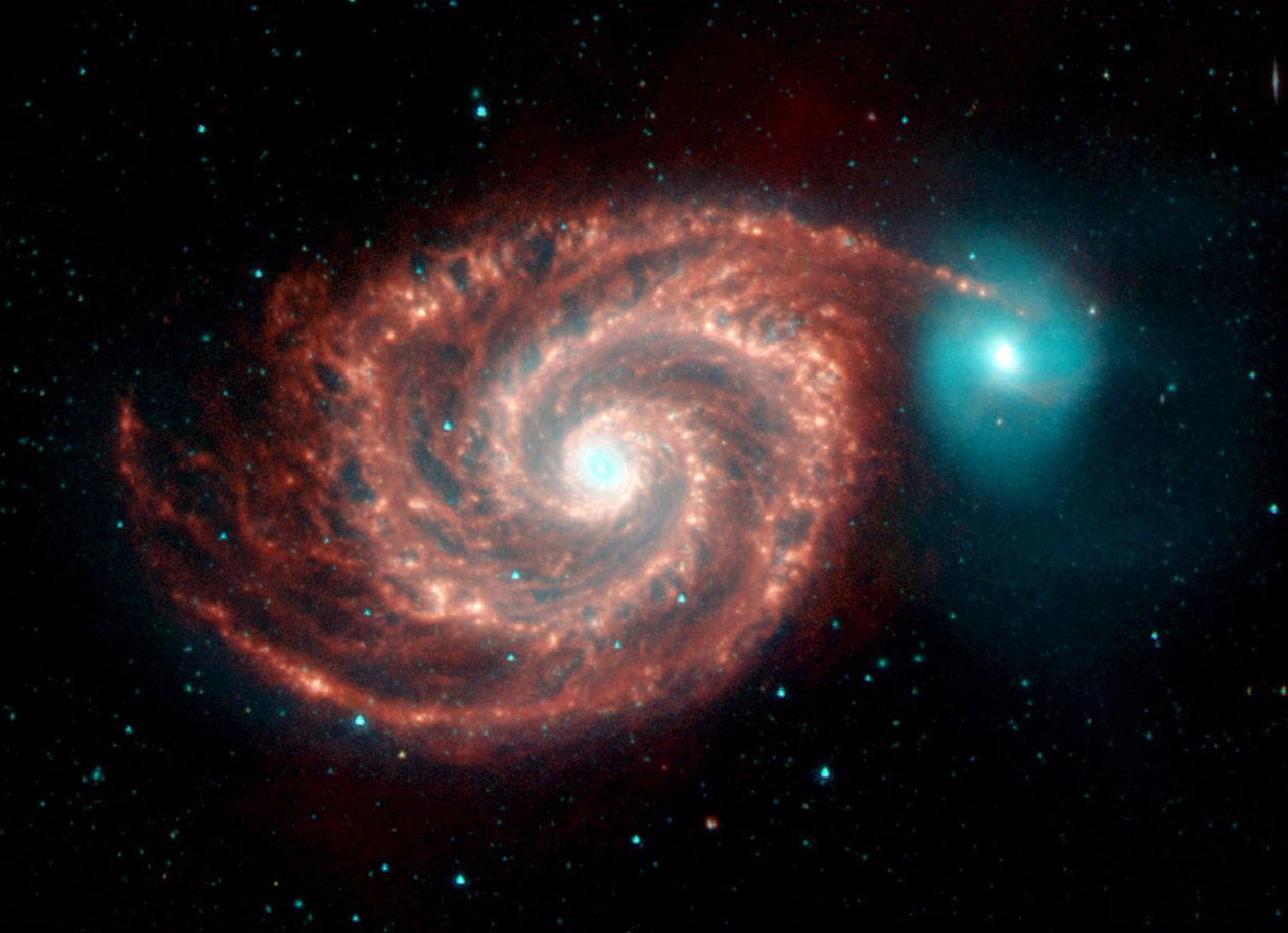 Image infrarouge du télescope spatial Spitzer de la galaxie du Tourbillon. Des structures étranges comblent les lacunes entre les bras spiraux riches en poussière et montrent la poussière, le gaz et les populations stellaires dans la galaxie spirale brilla - National Aeronautics and Space Administration National Aeronautics and Space Administration