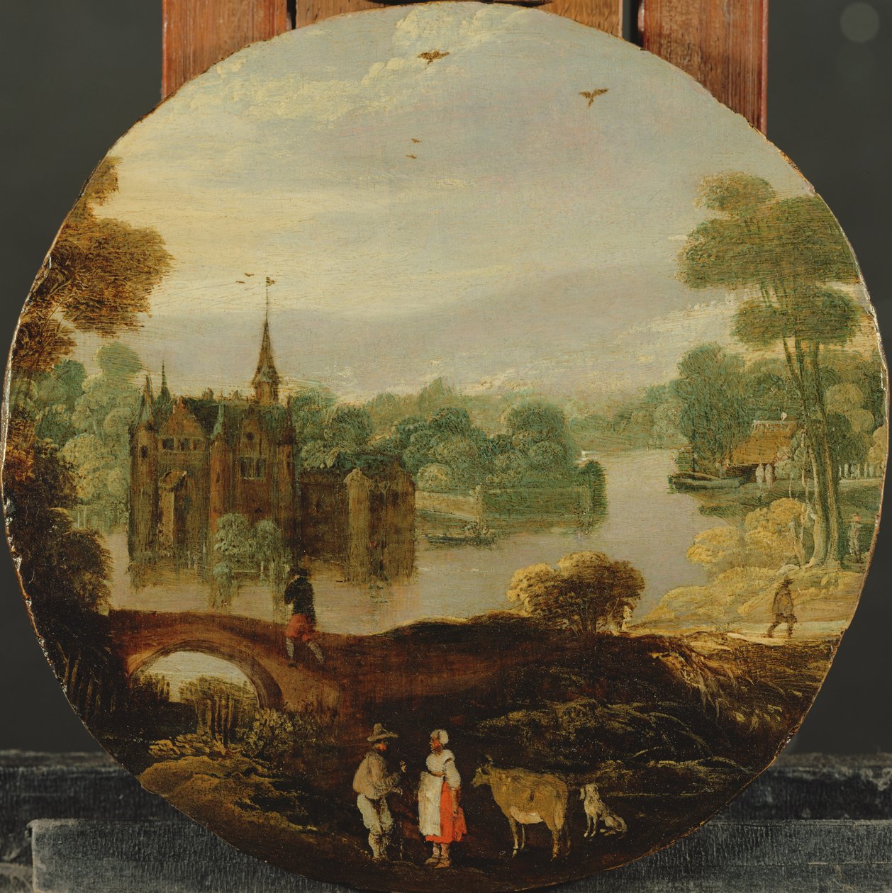 Paysage fluvial boisé avec un château et des voyageurs conversant - Tobias Verhaecht