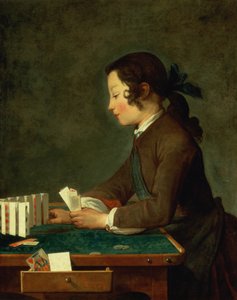 Jeune garçon jouant aux cartes