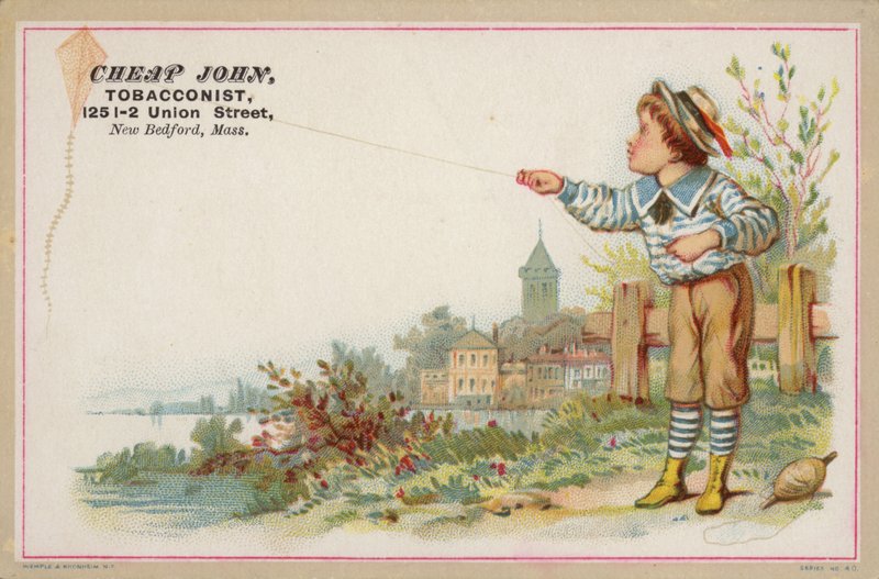 Garçon faisant voler un cerf-volant près du lac - American School
